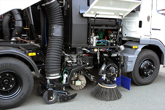 Detailed view of the mounted sweeper
